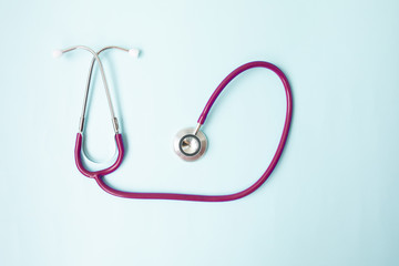 Color stethoscope on blue background. Healthcare.