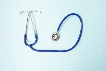 Color stethoscope on blue background. Healthcare.