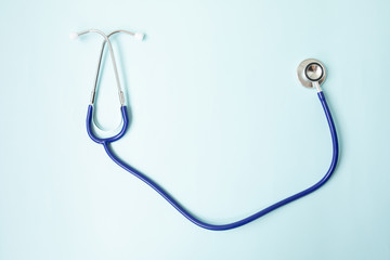 Color stethoscope on blue background. Healthcare.