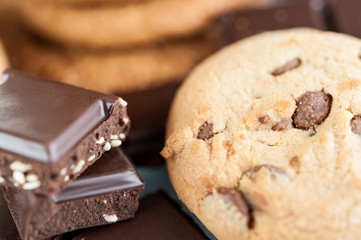 Various shortbread, oat cookies, chocolate chip biscuit and pieces of chocolate with seeds and nuts.