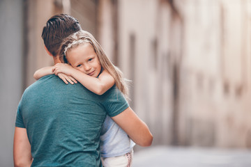 Happy dad and little adorable girl traveling in Rome, Italy