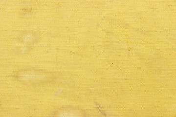 Texture and background of an old yellow surface. Sackcloth. Canvas background. Empty template and mockup. Vintage and grunge background.
