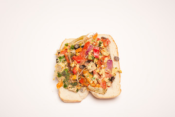 vegetable omelet in a black iron pan On a white background