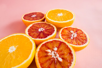 Summer background half of citrus. Creative summer pink background.