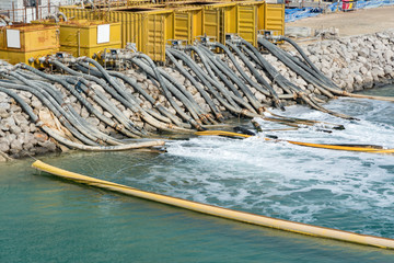 water pumping from construction site, flowing into the sea