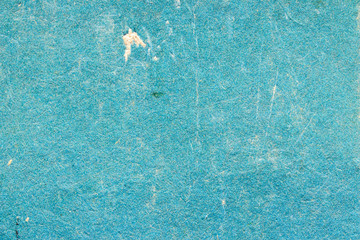 Texture of old cardboard blue color with scuffs. Empty and shabby background. Blue backdrop.	