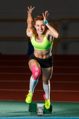 Female athlete starting her sprint race running