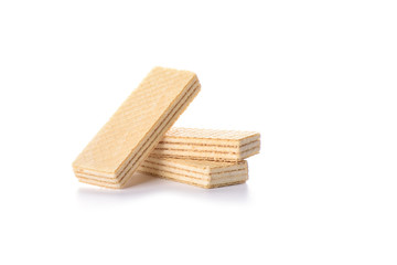 Multi-layered waffles with white creamy filling isolated on white background.