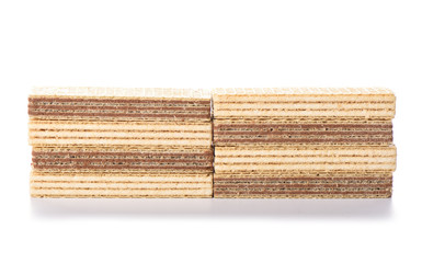 Multi-layered waffles with chocolate and white creamy fillings isolated on a white background.