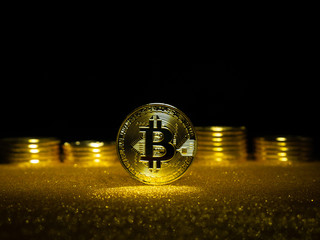 Bitcoin. Crypto currency Gold Bitcoin, BTC. Macro shot of Bitcoin coins. Blockchain technology,...