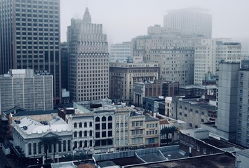 A panorama on downtown full of high buildings in a fog 