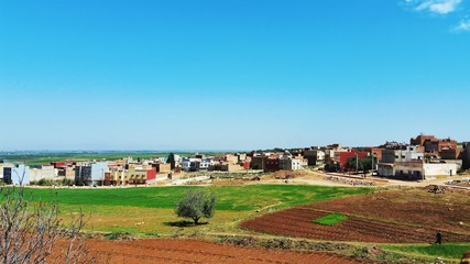 Fototapeta na wymiar rural landscape with houses and blue sky