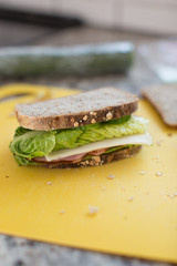 sandwich with ham, cheese, cucmber and lettuce