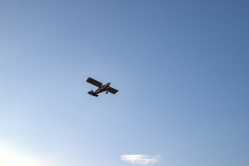 Small airplane against blue sky. Old small plane..
