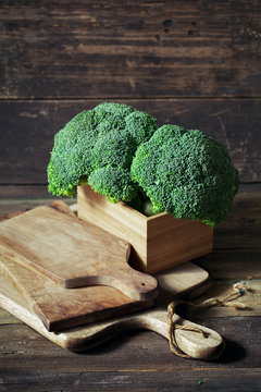 Fresh Broccoli on wooden boards
