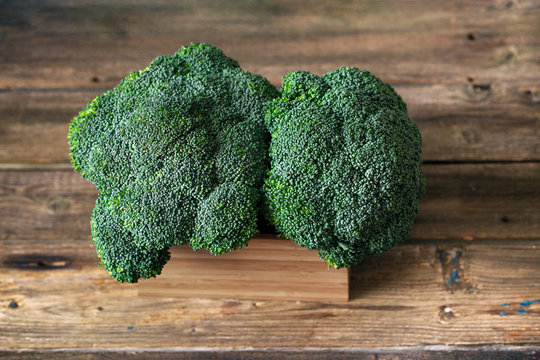 Fresh Broccoli on wooden boards