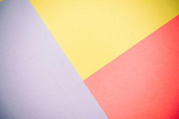 Blue, pink and yellow pastel color paper geometric flat lay background