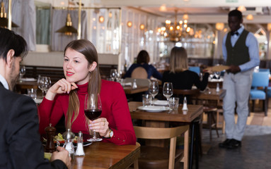 Girl with boyfriend in restaurant