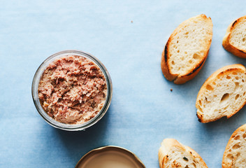 Homemade duck pate foie gras in a jar top view space for text