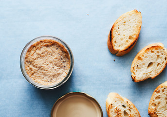 Homemade fresh duck pate foie gras in a jar top view space for text