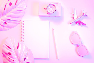 Creative layout with copy space and various summer objects on pastel pink background. Minimal vacation concept. Flat lay.