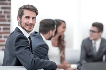 portrait of a successful businessman on the background of the office