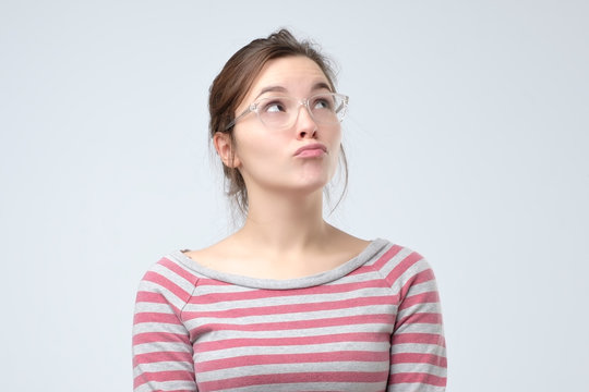young woman pouting lips, making duck face