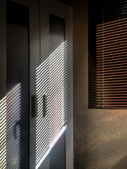 Wardrobe with windows blind artistic shadow