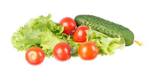Fototapeta na wymiar Fresh green cucumber, red tomatoes and green salad leaves isolated on white background. Ingredients for vegetable salad