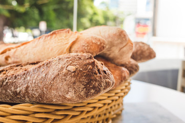 Basket full of whole grain roll breads