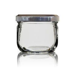 The empty glass jar closed by a cover with reflection. Isolated on a white background