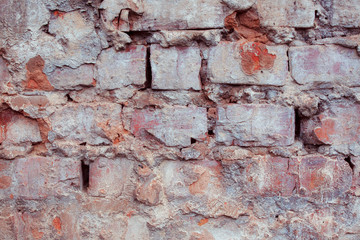 Old textured brick wall with natural defects. Scratches, cracks, crevices, chips, dust, roughness. Can be used as background for design or poster.