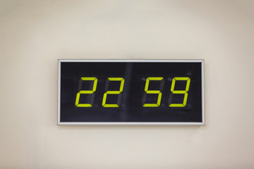 Black digital clock on a white background showing time 22.59 minutes