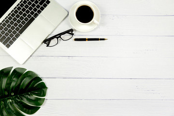 Workspace in office , Wooden White desk with blank notebook and other office supplies,Top view with copy space.