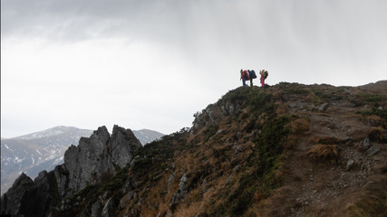 Hike group of tourists to the high mountains.