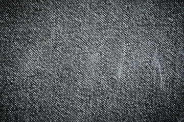Textures of black jeans denim fabrics for the background.