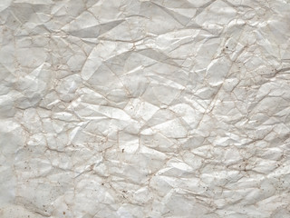 Texture background from old crumpled faded paper or parchment. Old paper texture