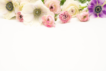 Obraz na płótnie Canvas White Anemones and Pink Ranunculus Floral Flat Lay Background