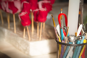 Confectionery decoration. Baker making wedding or birthday marzipan roses