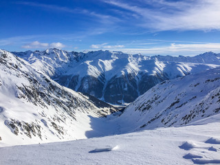 Obraz premium Swiss mountains on a cold winter day. Snow covered peaks in remote area.