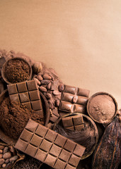 Cocoa beans and chocolate on natural paper background