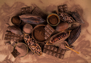 Cocoa beans and chocolate on natural paper background