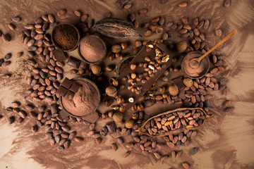 Cocoa beans and chocolate on natural paper background