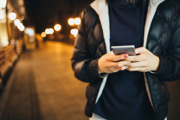 Close-up female's hands holding smart phone
