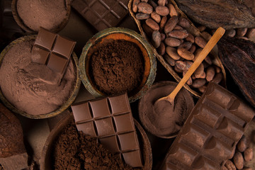 Cocoa beans and chocolate on natural paper background