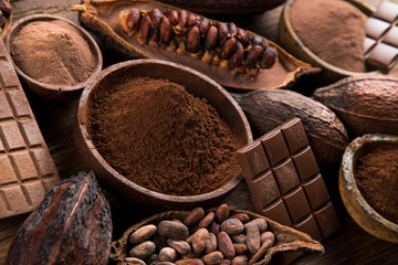 Cocoa beans and chocolate on natural paper background