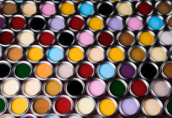 Group of tin metal cans with color paint