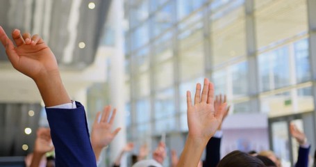 Multi ethnic business people raising hands in the business seminar 4k