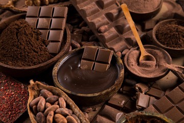 Cocoa beans and chocolate on natural paper background