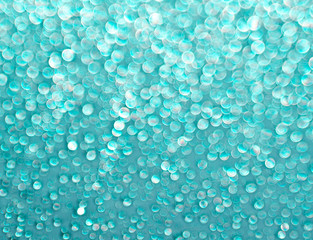 Turquoise background of shining drops of water